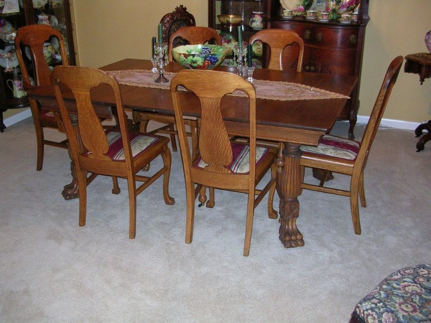 antique quartersawn oak table / 4 leaves and 6 chairs  